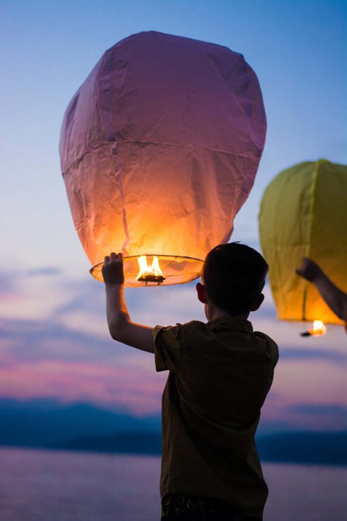 boy releasing memorial lantern balloon | What to do when you feel like a victim
